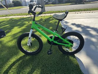 The RoyalBaby BMX Freestyle Kid's Bike with 14 inch wheels in GREEN  for young riders who love to perform tricks and stunts. Made of durable 