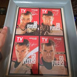 Framed 1999 TV guide flyers covers display
