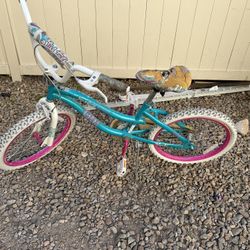 Cute little girls bike with 20-inch wheels, perfect for kids learning to ride or riding around the neighborhood.