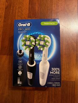Twin pack electric toothbrushes
