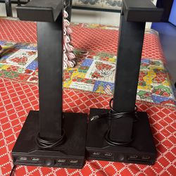 2 headset holders with LED lights on the bottom