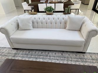 White tufted sofa