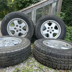 (4) Preowned Tires And Factory Jeep Rims 225/75R16