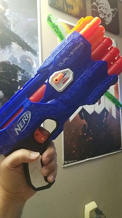 Nerf brand Dual-Strike Blaster. Mint condition, loaded with standard and mega darts.