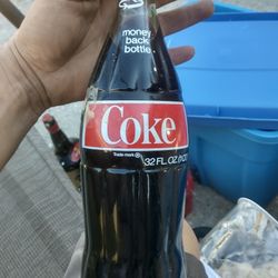 vintage 32 oz Coca-Cola bottle still full