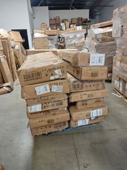 They are all bed frames—a mix of Full, Queen, and King sizes bundled on a single pallet.