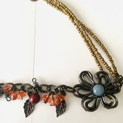 Vintage Beaded Necklace by Marlyn Schiff with Flower Pendant  Features a metal flower pendant with colorful beads and leaf charms. 16”