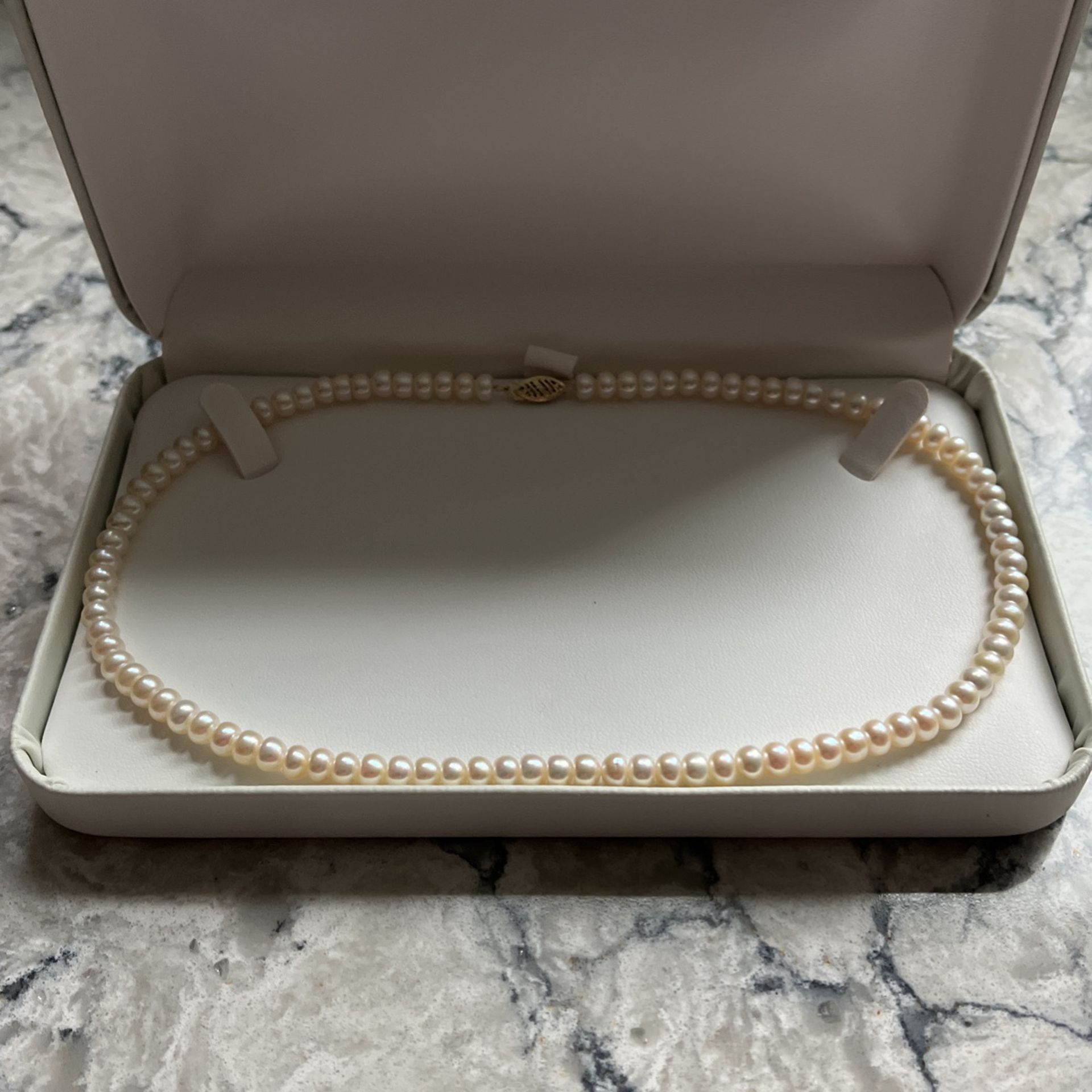Pearl Necklace 17 1/4 Inches Long With 10 KT Gold Clasp.