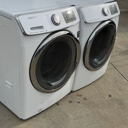 Front Load Samsung Washer And Dryer Electric High Efficiency working perfectly extra lfor delivery same day delivery and installation available