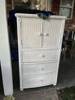 Wicker dresser and open doors sweaters pance 4 1/2 feet tall