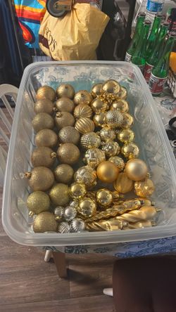 58 ornaments in various designs and sizes; gold and light pink.