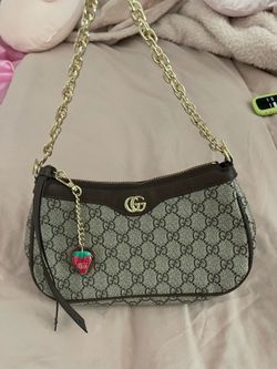 Gucci strawberry pendant bag