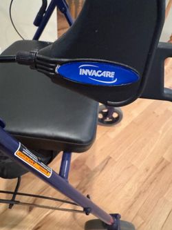 Invacare Wheeled walker with wheels and a seat