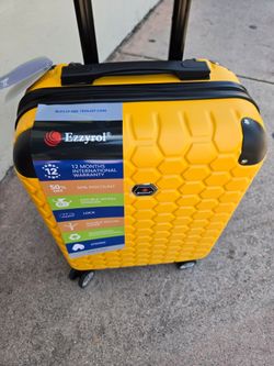 Travel Suitcase 20" Carry On. 8 Wheels Spinner Hard Shell New With Tags Combination Lock Extra Lightweight Expandable Waterproof yellow color