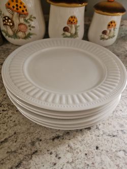 white Oneida Majesticware "Athena" serving plates featuring a beaded and ribbed border.