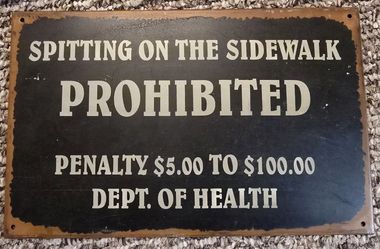 Spitting on Sidewalk Vintage Metal Sign