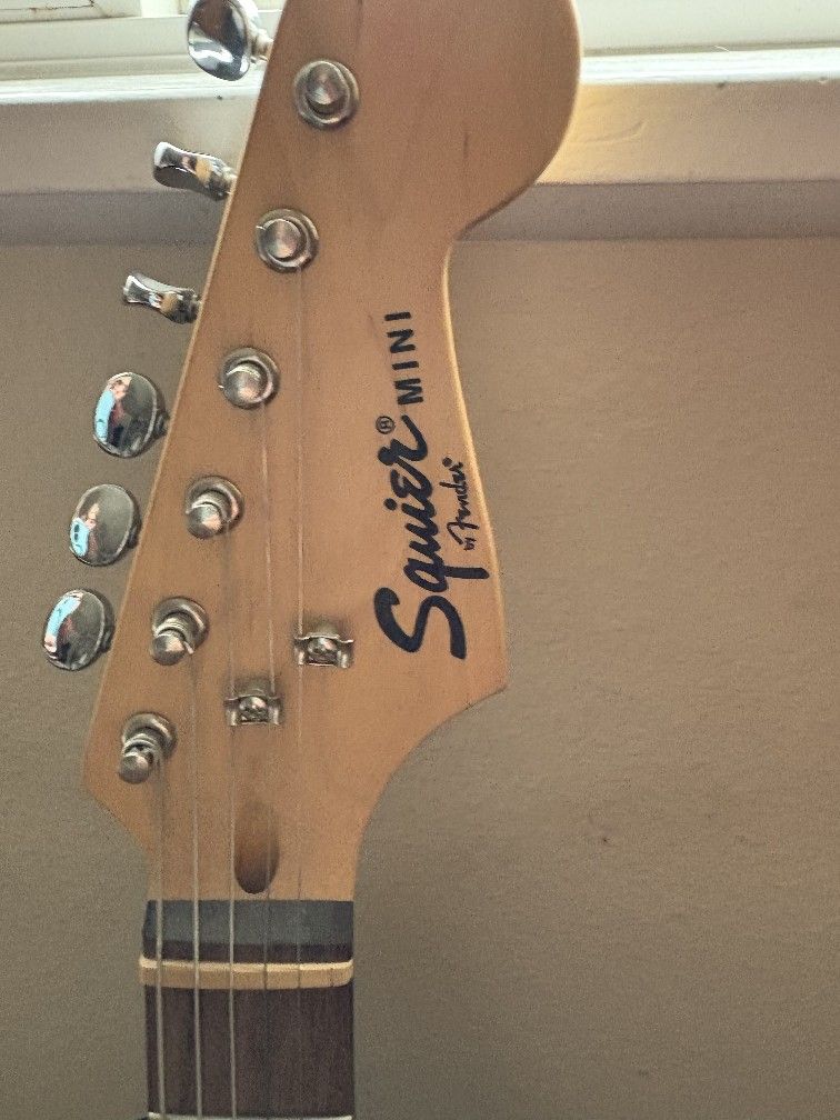 Squier Mini by Fender Electric Guitar, Epiphone Amp, guitar stand, guitar strap and all cords