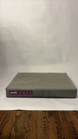 Purple brand dog bed with washable grey cover