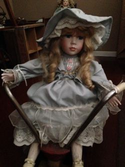 Porcelain doll & antique wooden scooter