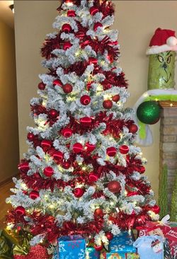 6-1/2 Ft.flocked Christmas tree. Used 1 season only smoke free home see details