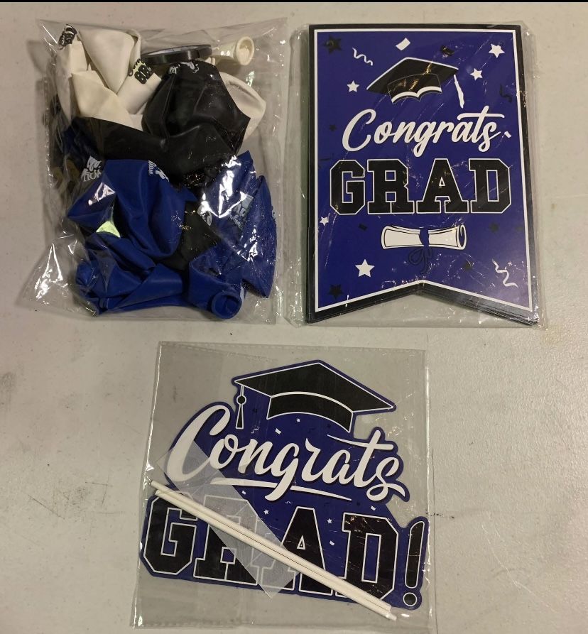 New graduation banner, tabletop decoration and 18 blue white and black balloons that say Happy Graduation, You did it and Congrats Grad