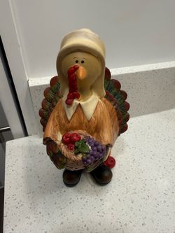 Pilgrim turkey lady resin figurine holding a cornucopia- 8 inches tall and 5 inches across