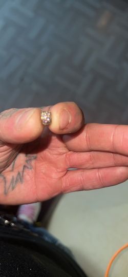 Small gold charm with pink stones