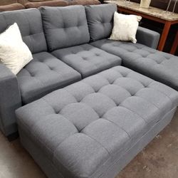 Grey Reversible Sectional With Ottoman 