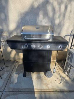 Barbecue grill with extra stove