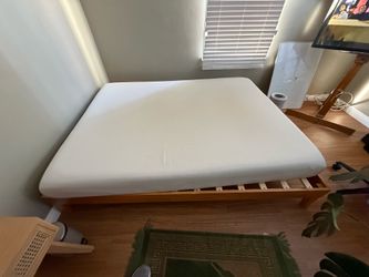 Queen mattress and wooden bed frame