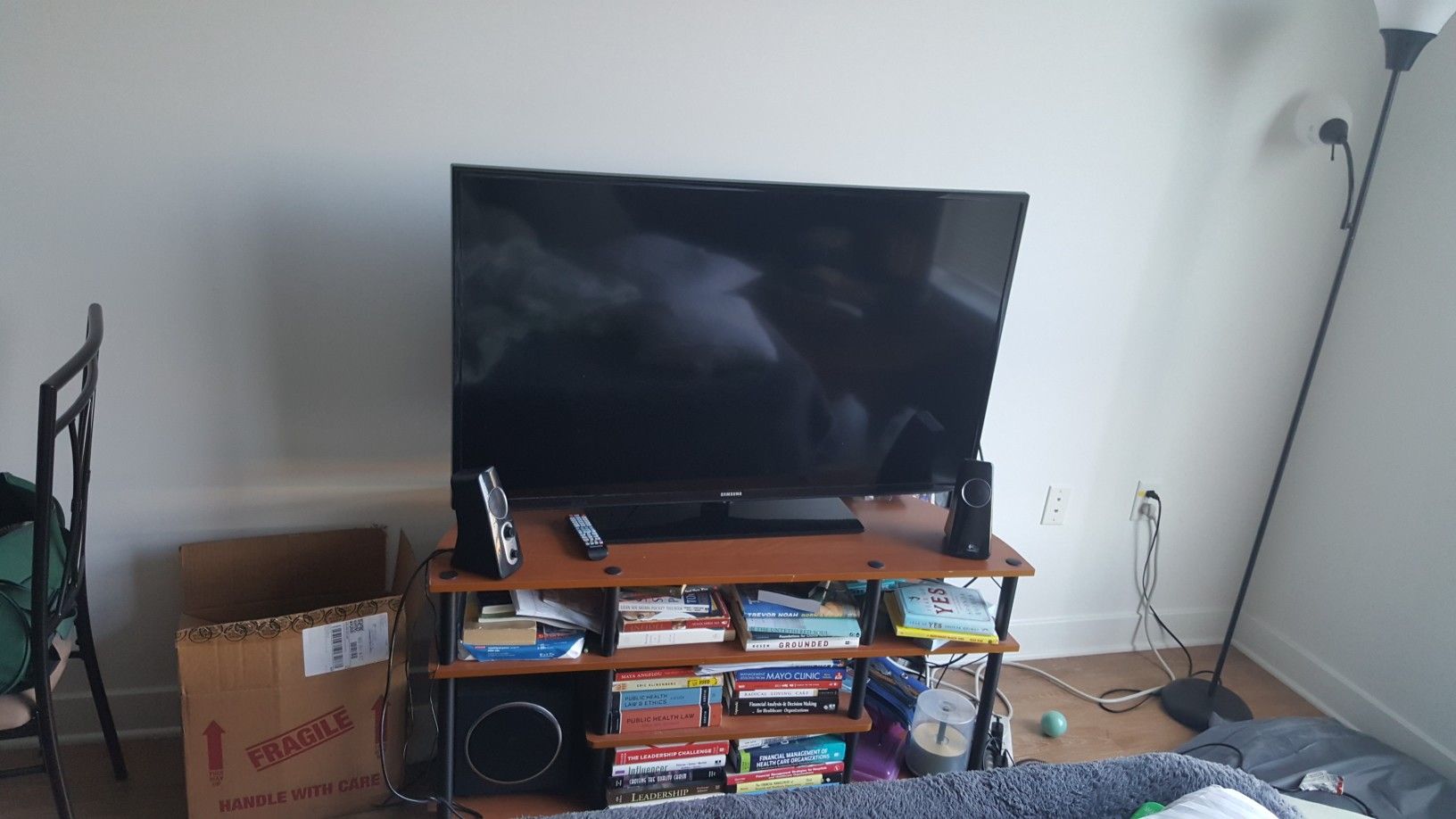 Quick move sale- 50 inch Samsung smart tv, speakers and stand. Negotiable