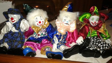 4 small Porcelain clown dolls