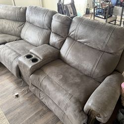 For sale: Comfortable gray reclining sectional sofa and matching dark brown lift-top coffee table. Both in good used condition – perfect for a family 