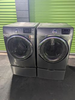 Samsung Front Load Washer and Gas Dryer Set with Pedestals Platinum Metallic Gray Finish