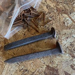 100 antique square nails and two railroad spikes