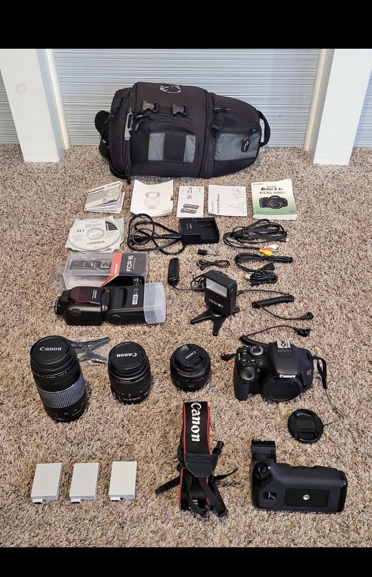 Canon eos rebel t3i bundle with 2 lenses, battery grip etc