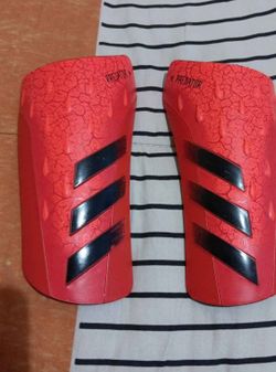 Red and Black Adidas Predator Shin Guards