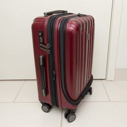 Red Delsey 4 wheel upright hard side spinner style carry on bag

