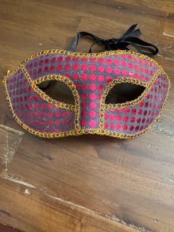 fuchsia-colored, glittery masquerade eye mask