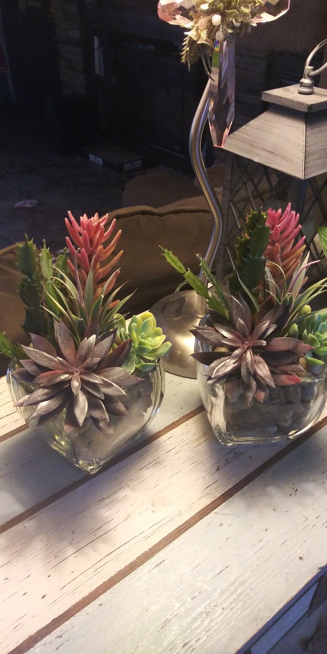Artificial succulents in glass bowls