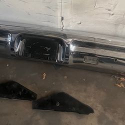 1967 PONTIAC GTO, LEMANS, TEMPEST REAR BUMPER WITH MOUNTING BRACKETS AND REVERSE LIGHTS IN VERY GOOD CONDITION ORIGINAL EQUIPMENT 