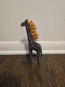 Whimsical beaded giraffe figurine