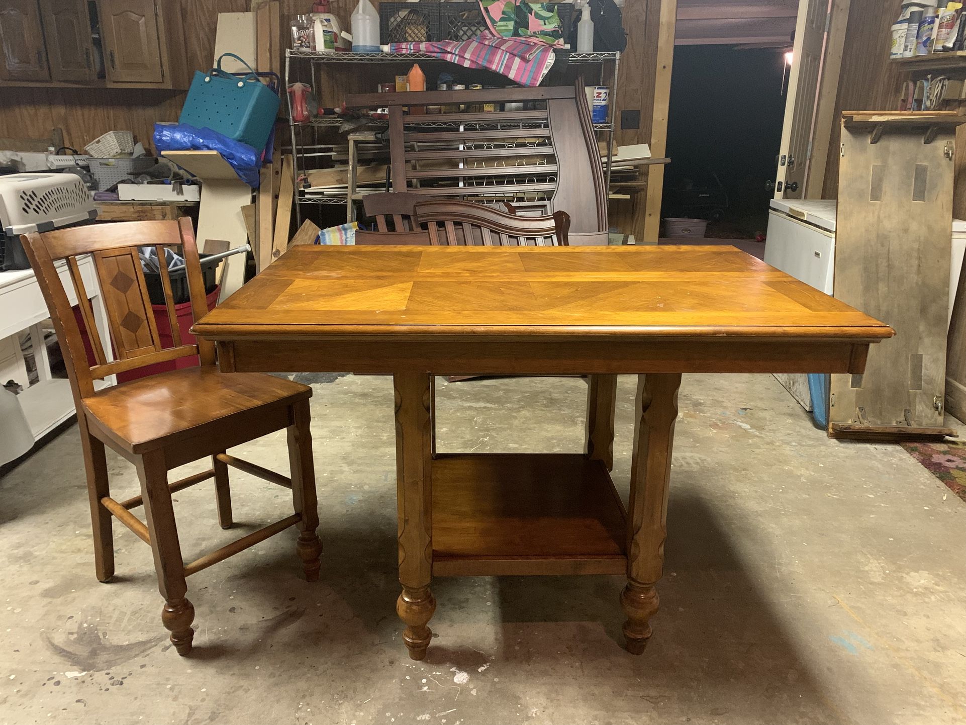 Wood table with 4 chairs. Bar height also has a leaf