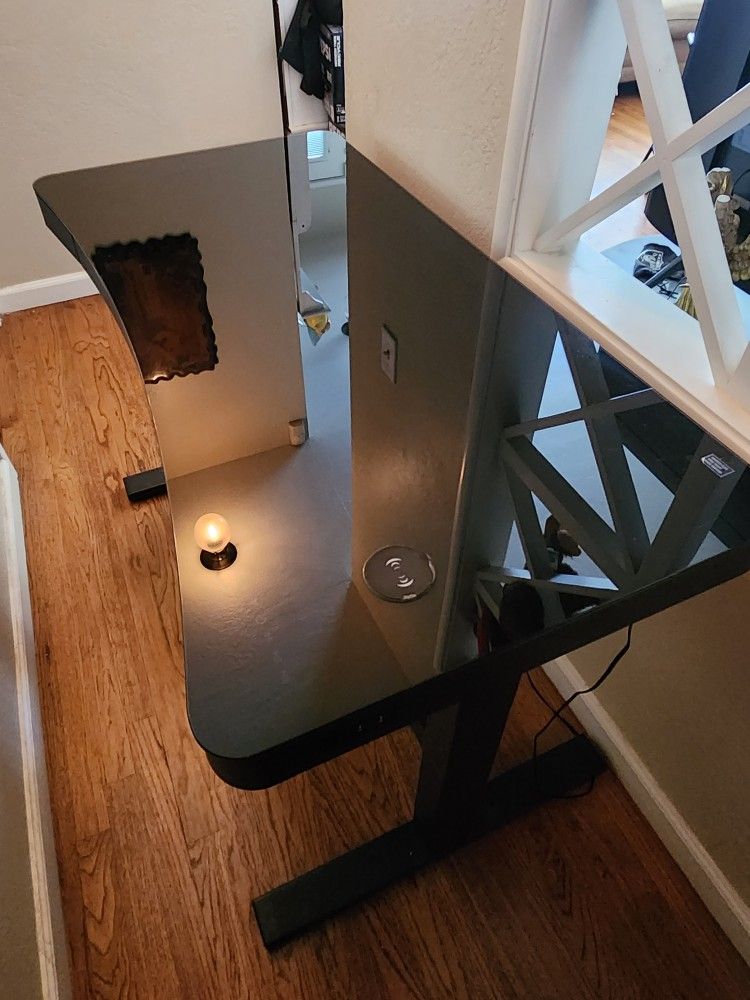 Tempered Glass/Metal Electric Standing Desk w/ Built-In Charging Pad, Drawer, and 2 USB ports.
