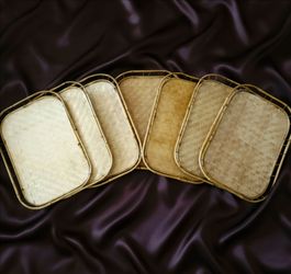 Set of 7 vintage mid-century modern bamboo and rattan stacking serving trays.