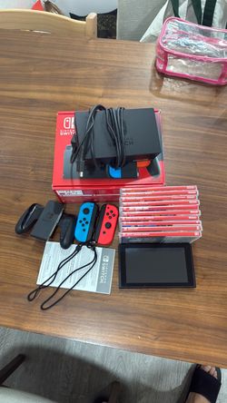 Like new Nintendo switch with 2 controllers and  10 games