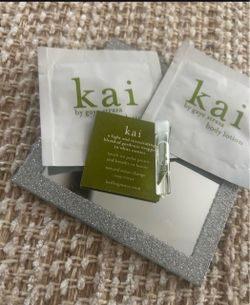 Kai Signature Perfume Oil Sample: A small vial of the gardenia and white exotic floral scent.Kai Body Lotion Packettes