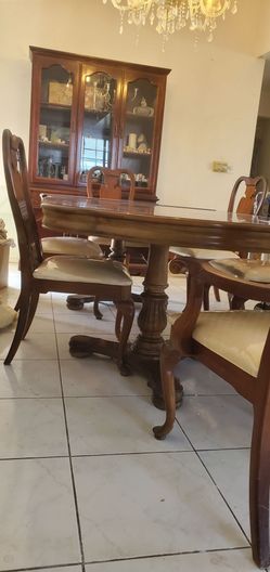 Wood dinning room table with 6 chairs and display cabinet
