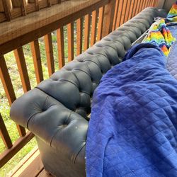 Chesterfield-style leather sofa