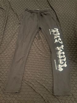 Black stacked sweats with white lettering